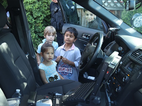 Kids-looking-in-police-vehicle-during-National-Night-Out-event.jpg