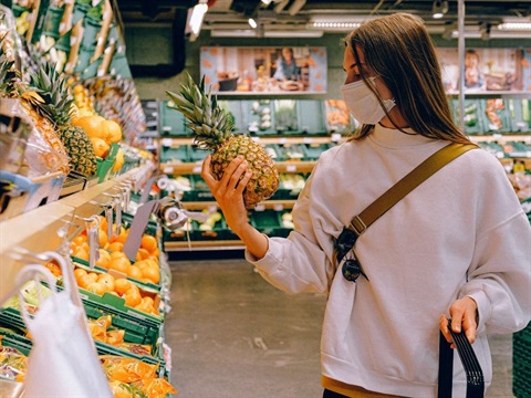 Girl wearing mask in grocery store.jpg
