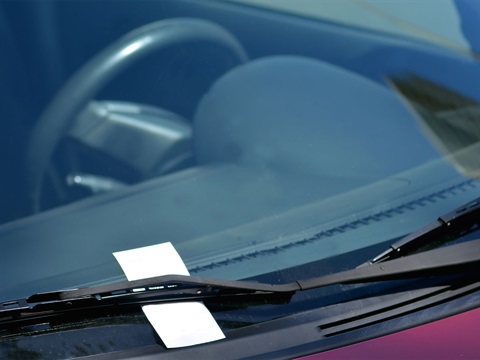parking-citation-under-the-wiper-on-a-car-windshield.jpg