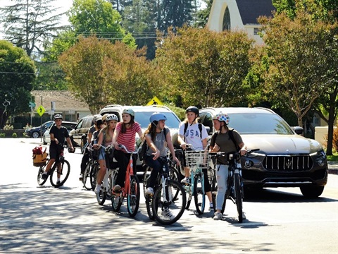 group-of-students-ride-bikes-on-Santa-Cruz-Avenue-toward-downtown.jpg