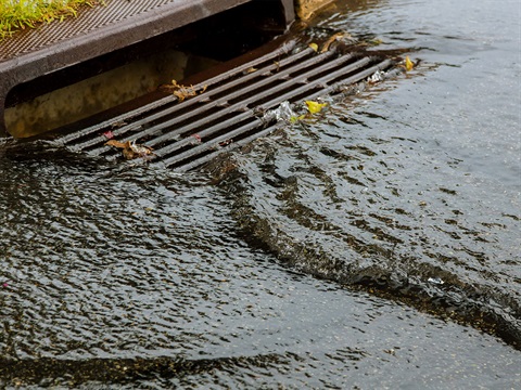 rain-water-flowing-into-storm-drain-and-city-stormwater-system.jpg