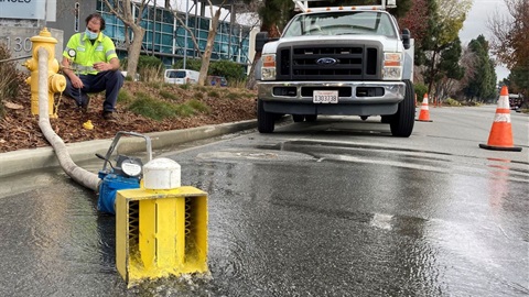 Crew member flushing water main using hydrant.jpg