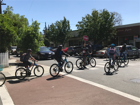 OpenCities--young-kids-on-bikes-going-through-crosswalk.png