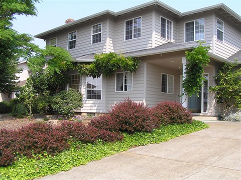 two-story-single-family-residential-home-with-driveway-and-open-door.jpg