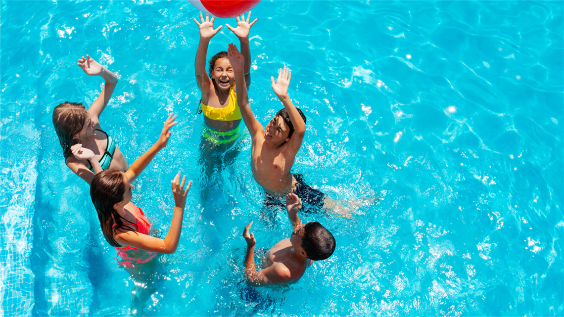 Group of teens playing in a pool