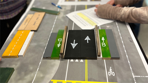 road-model-with-individual-completing-survey