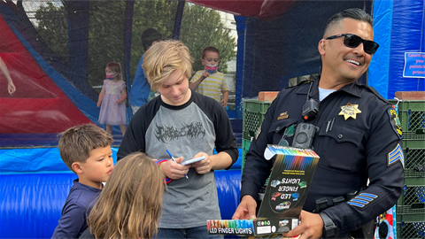 Menlo Park Police Officer with children at National Night Out