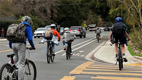 Children riding bikes in street