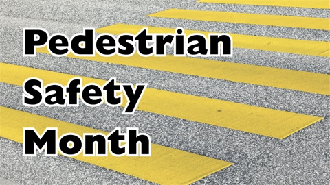 Pedestrian Safety Month text on crosswalk background