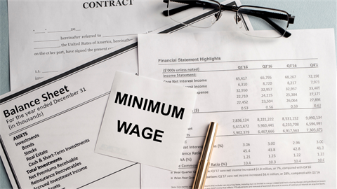 Minimum wage text on papers
