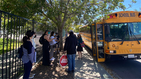 People outside school bus