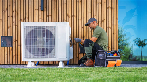 Man installing air conditioning unit