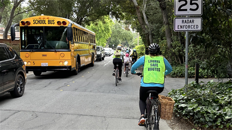 Bicyclists with school bus