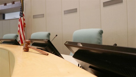 City Council dais with flag and gavel.jpg