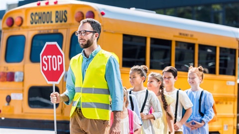 Crossing guard with students.jpg