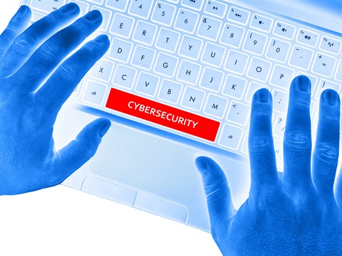 Cybersecurity-on-space-bar-of-laptop-keyboard-with-hands-on-keyboard.jpg