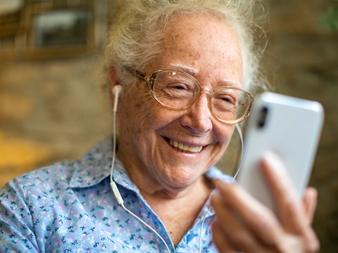 Elderly-woman-uses-mobile-phone-for-video-call.jpg