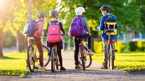 Four elementary school kids biking to school.jpg