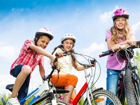 OpenCities--kids-on-bike-in-bright-colors-outside (1).jpg