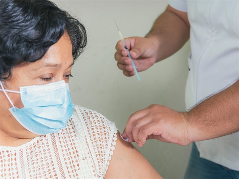 OpenCities--older-hispanic-female-receives-flu-shot-from-doctor.jpg