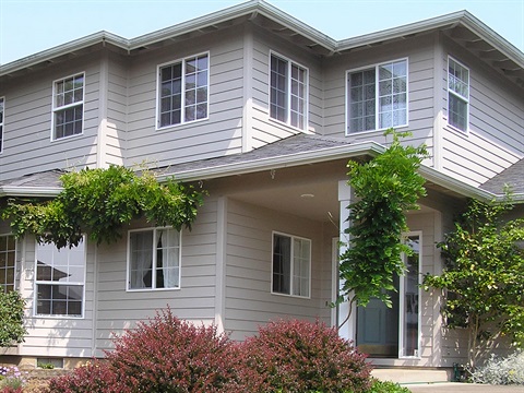 OpenCities-two-story-house-with-driveway-and-front-door-open.jpg