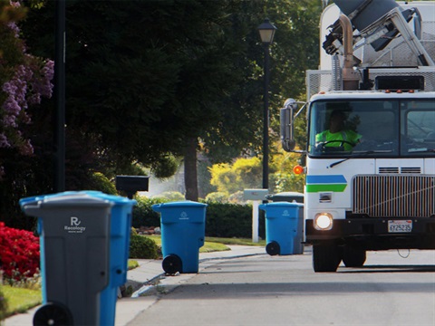 Recology-waste-collection-truck-on-residential-street.jpg