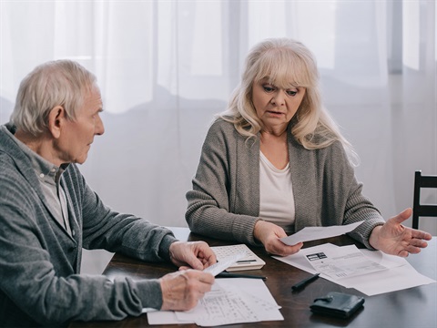 senior-couple-go-over-their-bills.jpg