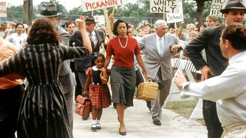 still from movie Ruby Bridges and mother walking over picket line.jpg