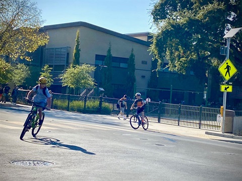 Students-riding-biycles-on-Santa-Cruz-Avenue-next-to-Hillview-school.jpg