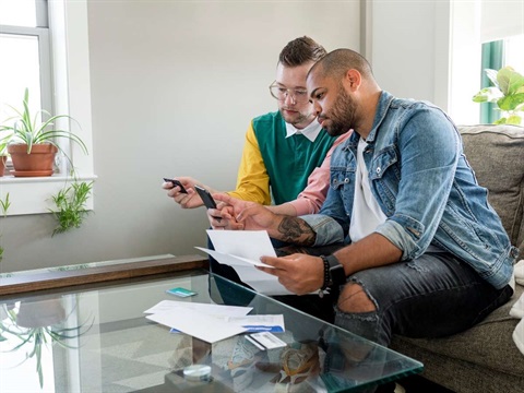 Two men looking at household bills.jpg