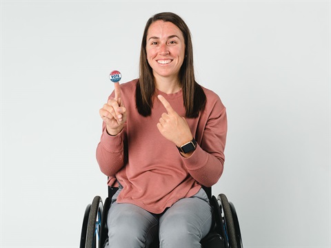 woman-in-wheelchair-displays-Vote-sticker.jpg