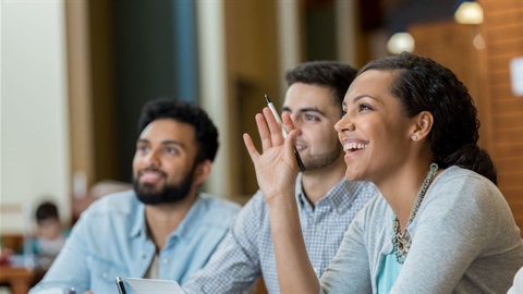 Woman raising hand at meeting.jpg