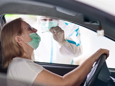 Woman-receives-COVID-19-test-at-drive-thru-testing-site.jpg