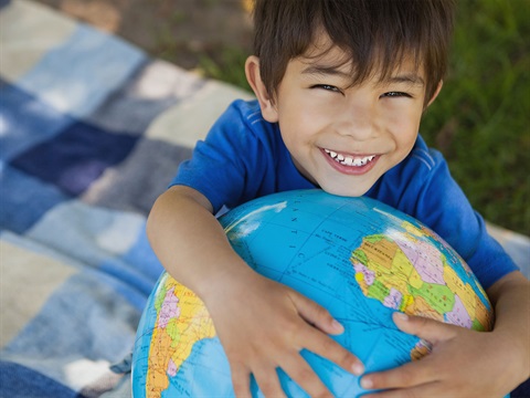 Young-boy-hugs-globe-for-Earth-Day.jpg