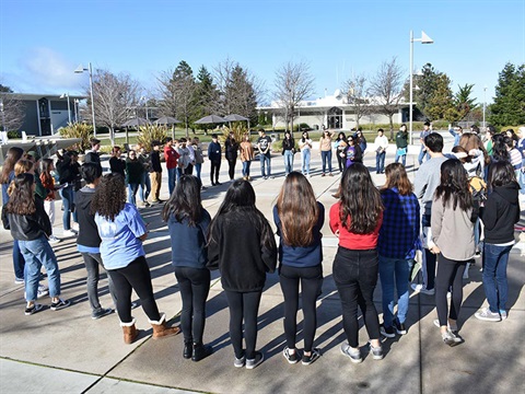 Youth-Climate-Ambasadors-stand-in-a-circle-outside.jpg