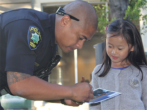 OpenCities--Police-officer-signs-autograph.png